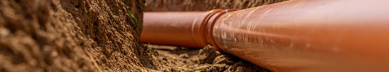 A pipe in a dug out underground channel