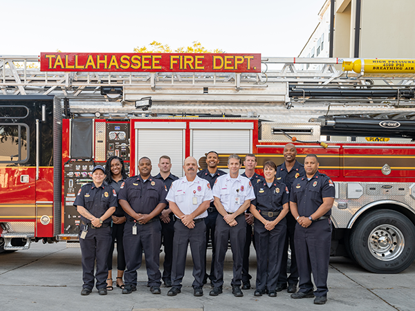 TFD Officers standing in front of a truck